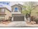 Charming two-story home with a well-maintained front yard and a two car garage in a suburban neighborhood at 9545 Parker Springs Ct, Las Vegas, NV 89166