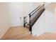 Welcoming foyer with tile flooring, staircase featuring dark wood banister and a white front door at 9545 Parker Springs Ct, Las Vegas, NV 89166