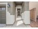 Inviting front entrance featuring a gated entry and decorative lighting fixtures leading to the front door at 9545 Parker Springs Ct, Las Vegas, NV 89166