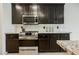 The kitchen features stainless steel oven, microwave, and gas cooktop at 9545 Parker Springs Ct, Las Vegas, NV 89166