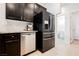 Kitchen features stainless steel refrigerator, dishwasher and dark wood cabinets at 9545 Parker Springs Ct, Las Vegas, NV 89166