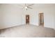The main bedroom features carpet and two entry ways, including one to the main bathroom at 9545 Parker Springs Ct, Las Vegas, NV 89166