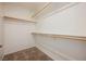 A spacious walk-in closet with carpet and multiple shelves for optimal storage at 9545 Parker Springs Ct, Las Vegas, NV 89166