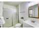 Modern bathroom features a walk-in shower, white vanity, and contemporary fixtures at 1012 Winwood St, Las Vegas, NV 89108