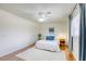 Bright bedroom with wood floors, ceiling fan and a neutral color scheme for a peaceful ambiance at 1012 Winwood St, Las Vegas, NV 89108