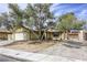 Charming home with mature trees, a two-car garage, and a welcoming front yard in a desirable location at 1012 Winwood St, Las Vegas, NV 89108