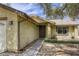 Inviting front entrance with a paved walkway, decorative chairs, and well-maintained landscaping at 1012 Winwood St, Las Vegas, NV 89108