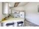 Cozy kitchen has a breakfast bar and white appliances at 1012 Winwood St, Las Vegas, NV 89108