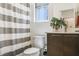 Bathroom featuring modern fixtures, a toilet, and a shower with a striped curtain at 10297 Sierra Skye Ave, Las Vegas, NV 89166
