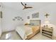 Cozy bedroom with neutral tones, a ceiling fan, and soft natural light at 10297 Sierra Skye Ave, Las Vegas, NV 89166