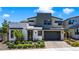 Stunning two-story modern home with stone accents, well-manicured landscaping, and a spacious two-car garage at 10297 Sierra Skye Ave, Las Vegas, NV 89166
