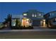 Modern two-story home boasting a brick and stucco exterior with a well-manicured front yard at 10297 Sierra Skye Ave, Las Vegas, NV 89166