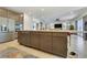 Spacious kitchen with modern cabinetry, stainless steel appliances, and a large island with seating at 10297 Sierra Skye Ave, Las Vegas, NV 89166