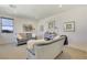 Bright living room featuring stylish sofas, decorative artwork, and ample natural light at 10297 Sierra Skye Ave, Las Vegas, NV 89166