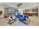 Open-concept living room with modern furnishings and a seamless transition to the outdoor patio at 10297 Sierra Skye Ave, Las Vegas, NV 89166