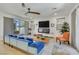 Bright and airy living room boasts contemporary furnishings, a modern fireplace, and seamless access to the outdoor living space at 10297 Sierra Skye Ave, Las Vegas, NV 89166