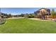 Scenic neighborhood park featuring lush green space, a playground, and walking paths for the community at 10297 Sierra Skye Ave, Las Vegas, NV 89166