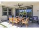Cozy patio area features an outdoor dining set and comfortable seating perfect for entertaining or relaxing at 10297 Sierra Skye Ave, Las Vegas, NV 89166