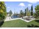 Beautiful pool area with lounge and artificial grass at 10297 Sierra Skye Ave, Las Vegas, NV 89166
