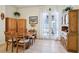 Cozy dining area with wood furniture, bright natural light, and access to the backyard patio at 10404 Stanberry Ave, Las Vegas, NV 89135