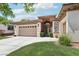 Beautiful home with a spacious driveway and wrought-iron gate leading to a cozy front courtyard at 10404 Stanberry Ave, Las Vegas, NV 89135