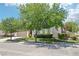 Picture-perfect home exterior featuring mature trees and lush landscaping, creating an inviting curb appeal at 10404 Stanberry Ave, Las Vegas, NV 89135