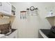 Laundry room with a sink, washer, dryer, and decorative storage at 10404 Stanberry Ave, Las Vegas, NV 89135