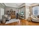 Cozy living room with hardwood floors, built-in shelves, and comfortable seating at 10404 Stanberry Ave, Las Vegas, NV 89135