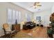 Inviting living room with hardwood floors, plantation shutters, and comfortable seating arrangement at 10404 Stanberry Ave, Las Vegas, NV 89135