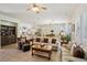 Open-concept living area featuring tile floors and comfortable seating, bathed in natural light at 10404 Stanberry Ave, Las Vegas, NV 89135