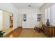 Well-lit room featuring hardwood floors, a built-in Murphy bed with shelving, and access to an adjacent bathroom at 10404 Stanberry Ave, Las Vegas, NV 89135