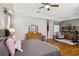 Spacious main bedroom with hardwood flooring, windows, a ceiling fan, and neutral paint color at 10404 Stanberry Ave, Las Vegas, NV 89135