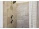 Contemporary shower with gray stone-look tile and modern fixtures at 10404 Stanberry Ave, Las Vegas, NV 89135