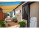 Cozy back patio with canvas shade sail and outdoor seating area for relaxation at 108 Verdy Ln, Las Vegas, NV 89101