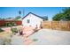 Wide backyard featuring a concrete patio area with desert landscaping, a modern fence, and seating at 108 Verdy Ln, Las Vegas, NV 89101