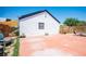 Open backyard featuring a concrete patio and desert landscaping at 108 Verdy Ln, Las Vegas, NV 89101
