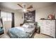 Comfortable bedroom with ceiling fan and eclectic decor at 108 Verdy Ln, Las Vegas, NV 89101