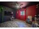 Unique bedroom with black ceilings and bright red walls at 108 Verdy Ln, Las Vegas, NV 89101