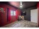 This bedroom features bold color contrasts, a ceiling fan, and wood-look floors, creating a modern, eclectic style at 108 Verdy Ln, Las Vegas, NV 89101