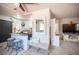 Open dining area flows to kitchen with sleek floors, island seating and view of open living space at 108 Verdy Ln, Las Vegas, NV 89101