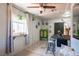 Bright dining area boasts plants, sleek floors, white brick walls, and contemporary fixtures at 108 Verdy Ln, Las Vegas, NV 89101