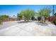 Large driveway with mature shade trees and landscaping, enhancing curb appeal at 108 Verdy Ln, Las Vegas, NV 89101