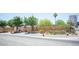 Landscaped front exterior with modern fence, showcasing desert landscaping and a charming single-story house at 108 Verdy Ln, Las Vegas, NV 89101