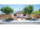 Charming single-story home with metal roof, white exterior, modern fence, and drought-tolerant landscaping at 108 Verdy Ln, Las Vegas, NV 89101
