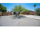 Expansive front yard with desert landscaping and a long driveway at 108 Verdy Ln, Las Vegas, NV 89101