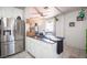 Kitchen island with stainless steel refrigerator in an airy kitchen at 108 Verdy Ln, Las Vegas, NV 89101