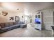 Bright living room features sleek floors, light gray walls, modern furniture, and lots of natural light at 108 Verdy Ln, Las Vegas, NV 89101