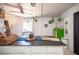 Bright living room, as viewed from kitchen with black countertops at 108 Verdy Ln, Las Vegas, NV 89101
