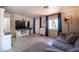 Cozy living room with sleek floors, entertainment center, modern decor, window and comfortable seating at 108 Verdy Ln, Las Vegas, NV 89101