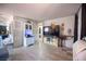 Open living room with sleek floors, white brick walls, entertainment center, and modern decor at 108 Verdy Ln, Las Vegas, NV 89101